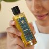 Person holding Padma 100% pure cold-pressed castor oil image on padma home page