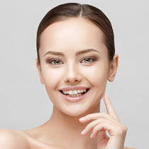 Smiling woman with hand near her clean face  image on padma home page