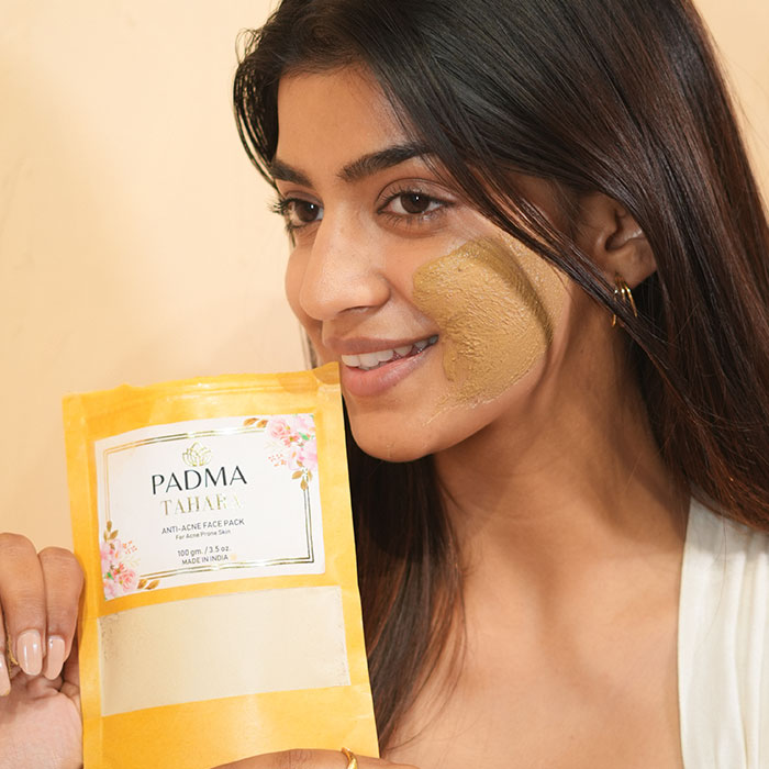 Woman with face mask holding Padma powder image on padma gallery page