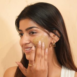 Woman applying face mask image on padma gallery page